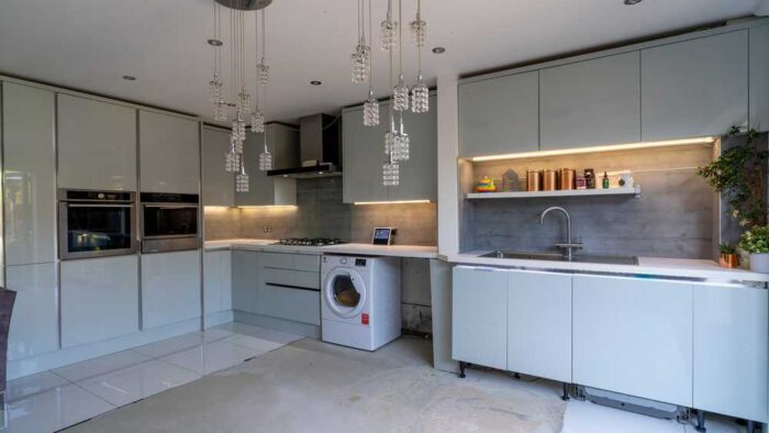 Wren Sky Blue Modern Slab Gloss Kitchen with Island – Hotpoint Appliances – White Laminate Worktops