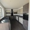 Young Howdens Hockley Dark Stone and Cream Gloss Kitchen – Lamona Appliances – Laminate Worktops