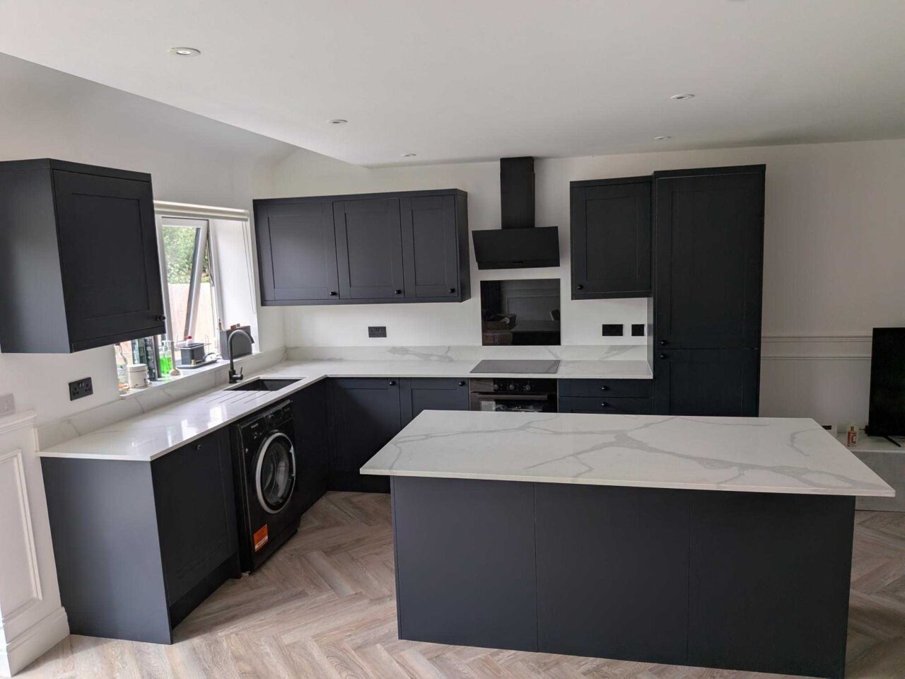 Young Navy-Blue Shaker Kitchen and Matching Island with Breakfast Bar – Prima Appliances – Quartz Worktops