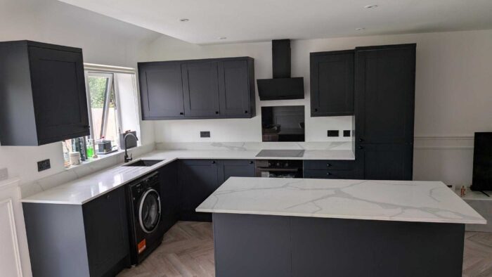 Young Navy-Blue Shaker Kitchen and Matching Island with Breakfast Bar – Prima Appliances – Quartz Worktops