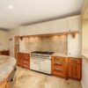 Bespoke-Large-Dovetail-Joint-Cream-and-Walnut-Kitchen-with-Large-Island-and-Dining-Table-Falcon-Siemens-Appliances-–-Granite-Worktops-–-3833064