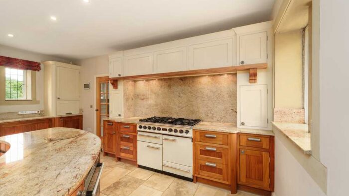 Bespoke-Large-Dovetail-Joint-Cream-and-Walnut-Kitchen-with-Large-Island-and-Dining-Table-Falcon-Siemens-Appliances-–-Granite-Worktops-–-3833064