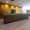 Ex Display Scavolini Liberamente Soxony Walnut & Stained Brass Kitchen and Island with Dining Table – Neff 1810 Appliances – Avenue Amber Iris Laminam Porcelain Worktops