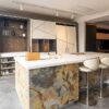 Ex Display The Wood Works Luxury Ascella Lacquered White with Aluminium Trim - Veneered Natural Slate Kitchen & Pocket Door Pantry with Matching Island & Wine Wall – Designer White Corian Worktops with Wine Trough