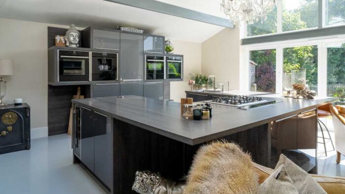 Graphite Grey Modern Slab Kitchen with Large U Shaped Island – Quooker Neff CDA Appliances – Laminate Worktops