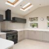 Stone Grey Shaker Kitchen with Peninsula and Utility Room – Brittania Neff De Dietrich Appliances – Resin Worktops