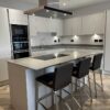 Young Dove Grey Modern Slab Kitchen and Matching Island – Neff Indesit Appliances – Silestone Worktops