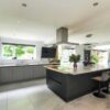 Young Ream Graphite Grey Modern Slab Kitchen and Large Island with Breakfast Bar – Quooker AEG Miele Appliances – Corian Worktops