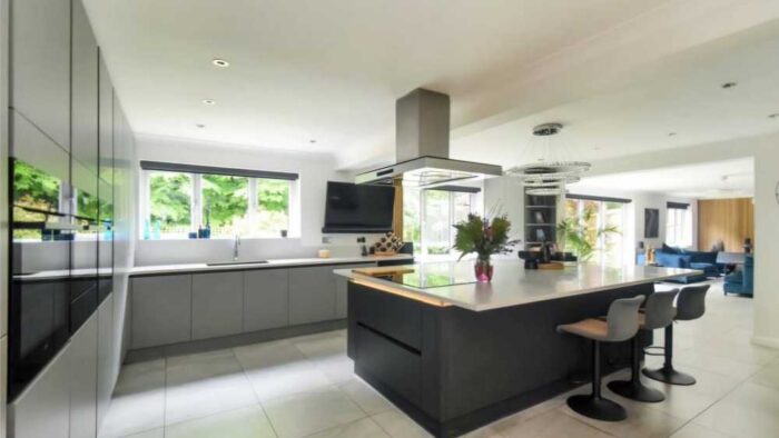 Young Ream Graphite Grey Modern Slab Kitchen and Large Island with Breakfast Bar – Quooker AEG Miele Appliances – Corian Worktops