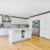 Part Bespoke & Part Howdens Cream with Brass Handled Dovetail Joint Kitchen with Island – Miele Neff Appliances – Dekton Worktops