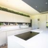 SieMatic Modern Slab Stone Light Cream Kitchen with Matching Island with Waterfall Sides – Miele Appliances – Glacier White Quartz Worktops