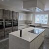 Large Wren Light Grey Gloss Kitchen with Island, Utility and Laundry Room - Neff Bosch Appliances – Quartz Worktops